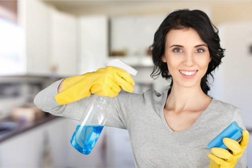 Cleaner removing plaster dust and residue during post renovation cleaning