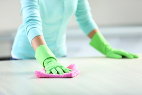 Office cleaners sanitising shared areas in Finsburypark