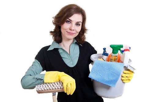 Trained technician using protective gloves during carpet cleaning